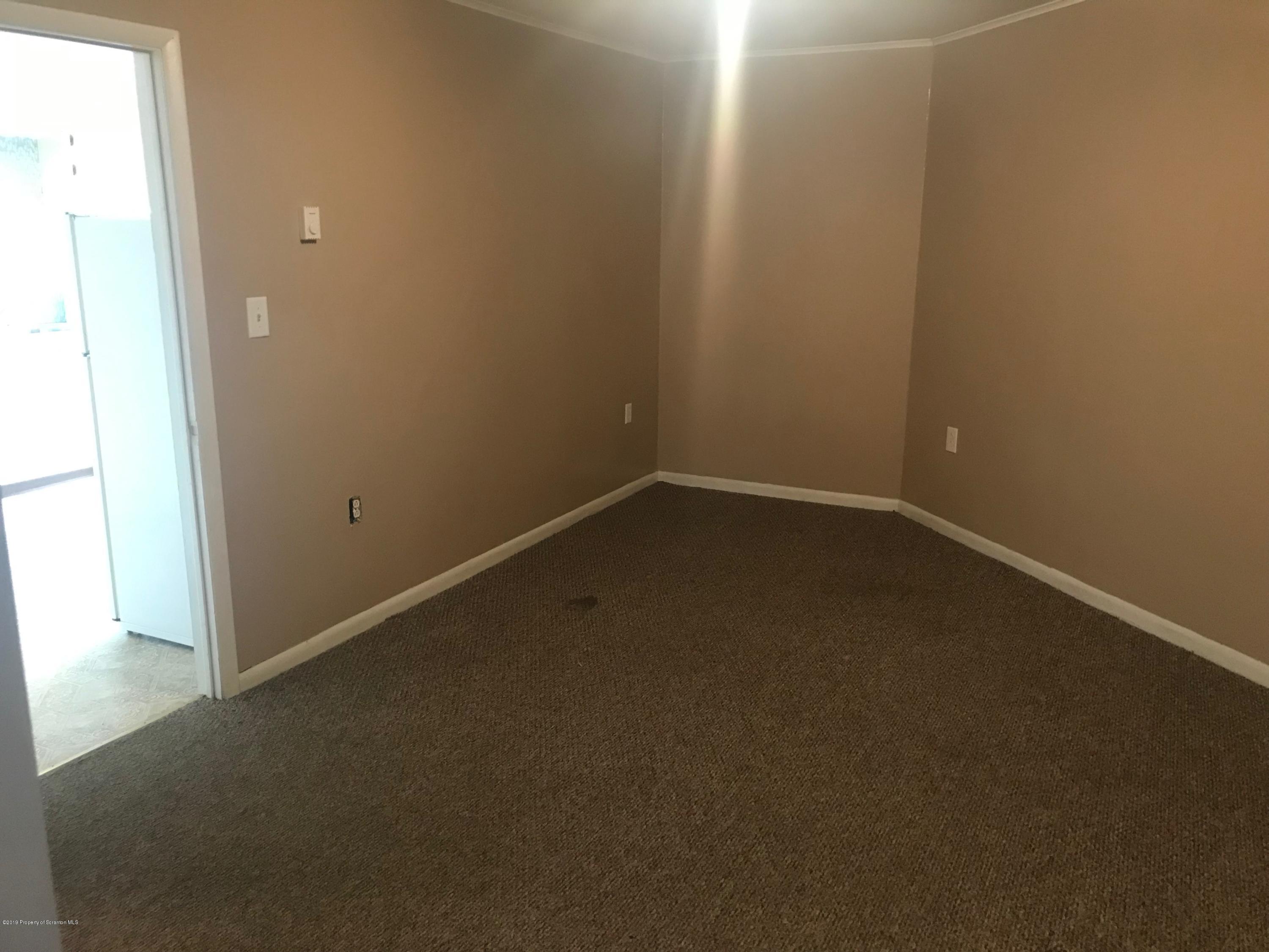 404 North Main Street, Unit 2 Simpson, PA 18407 - Photo 3 of 7 an empty room with a empty space