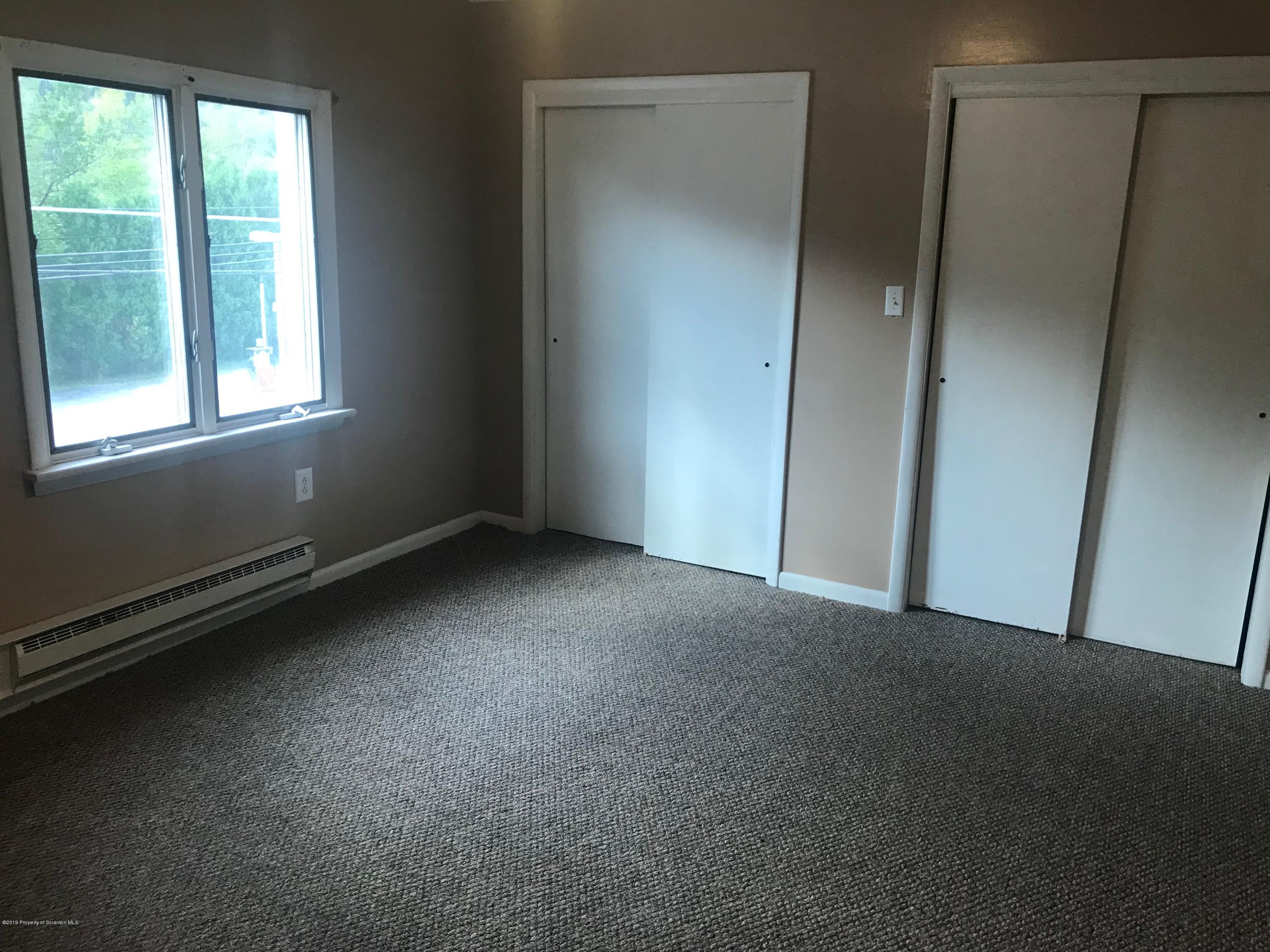 404 North Main Street, Unit 2 Simpson, PA 18407 - Photo 4 of 7 an empty room with windows