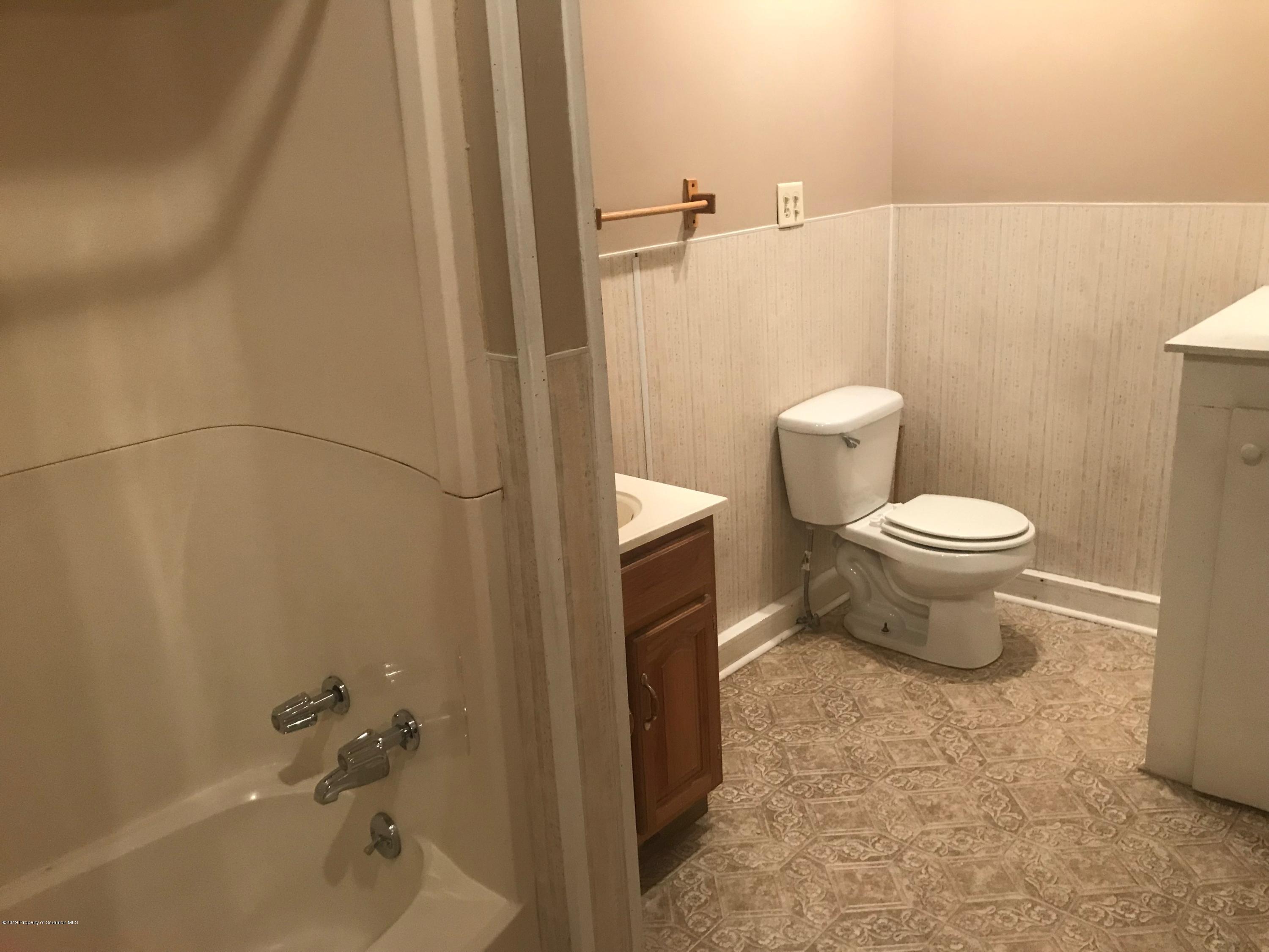 404 North Main Street, Unit 2 Simpson, PA 18407 - Photo 5 of 7 a bathroom with a toilet and a shower
