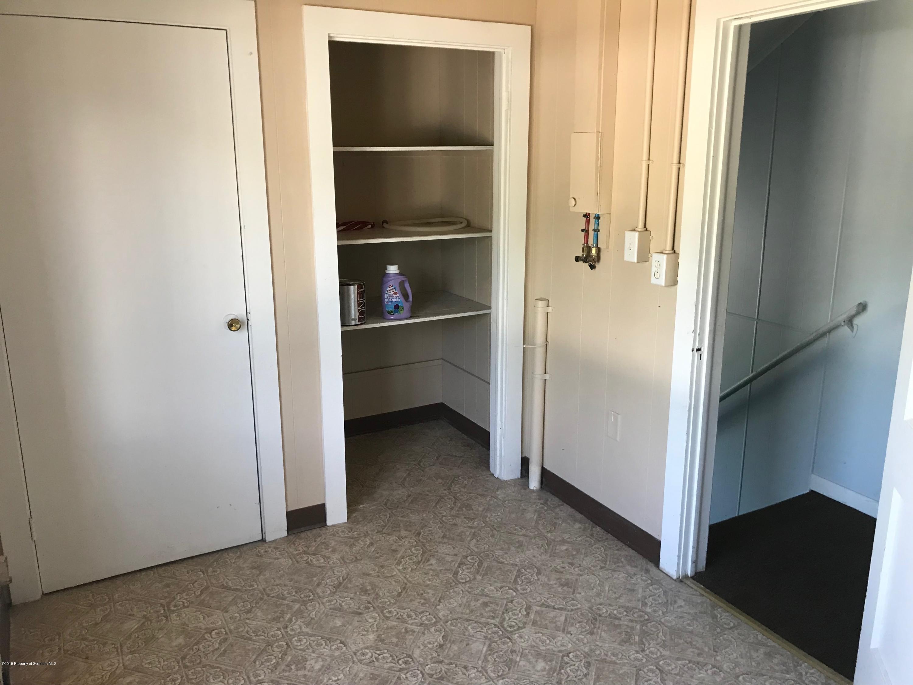 404 North Main Street, Unit 2 Simpson, PA 18407 - Photo 7 of 7 a view of a closet area with racks