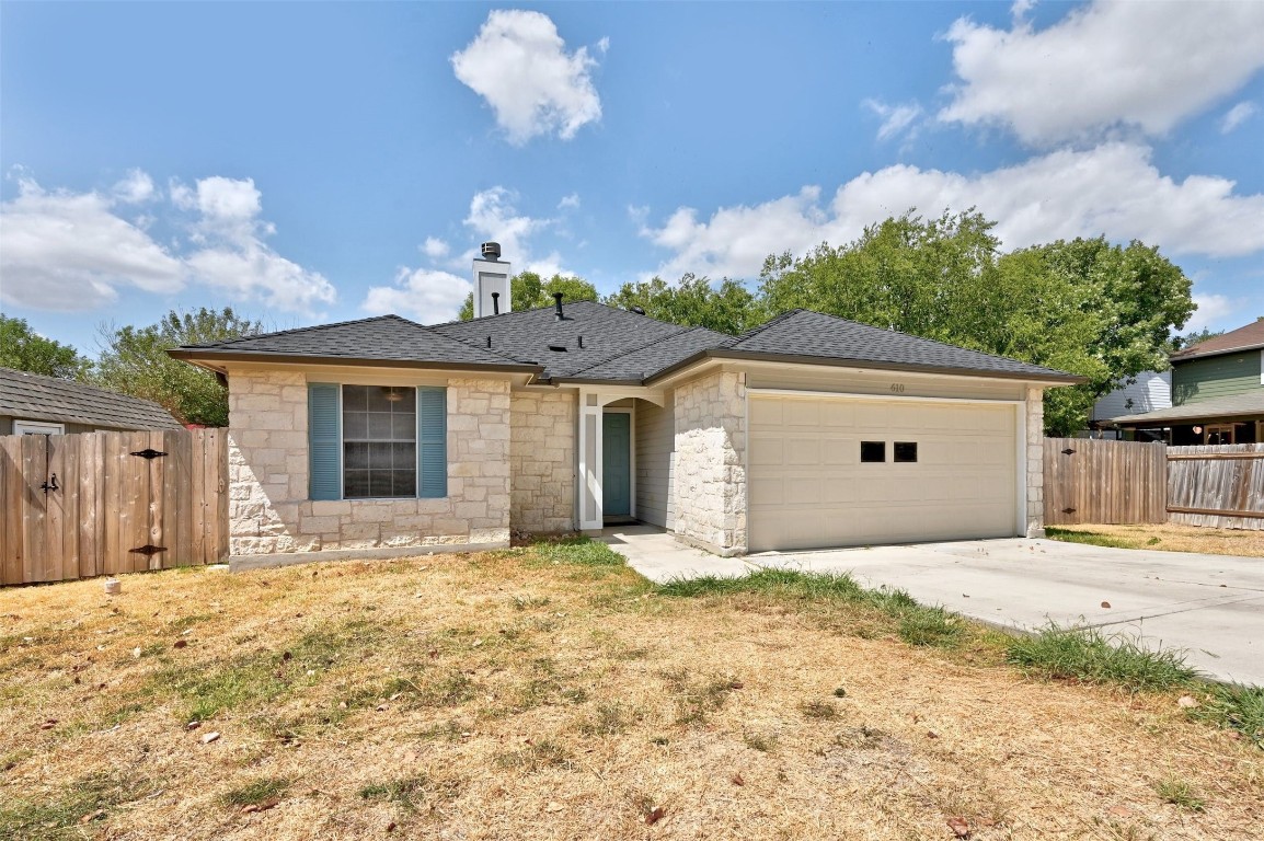 610 Basil Drive Buda, TX 78610 - Photo 1 of 1 a view of a house with a yard