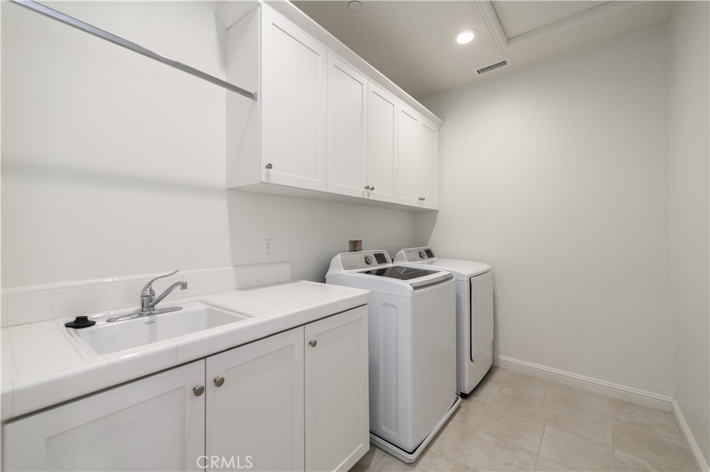 105 Bryce Run Lake Forest, CA 92630 - Photo 20 of 36 a utility room with dryer and washer