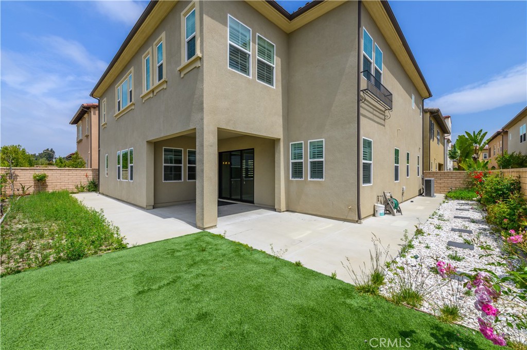 105 Bryce Run Lake Forest, CA 92630 - Photo 33 of 36 a view of a house with a yard and pathway