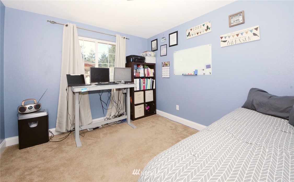 18131 Case Road Southwest Rochester, WA 98579 - Photo 14 of 16 a bedroom with a bed and a desk