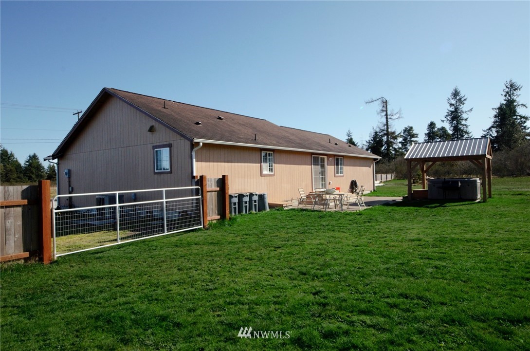 18131 Case Road Southwest Rochester, WA 98579 - Photo 15 of 16 a front view of a house with a garden and yard