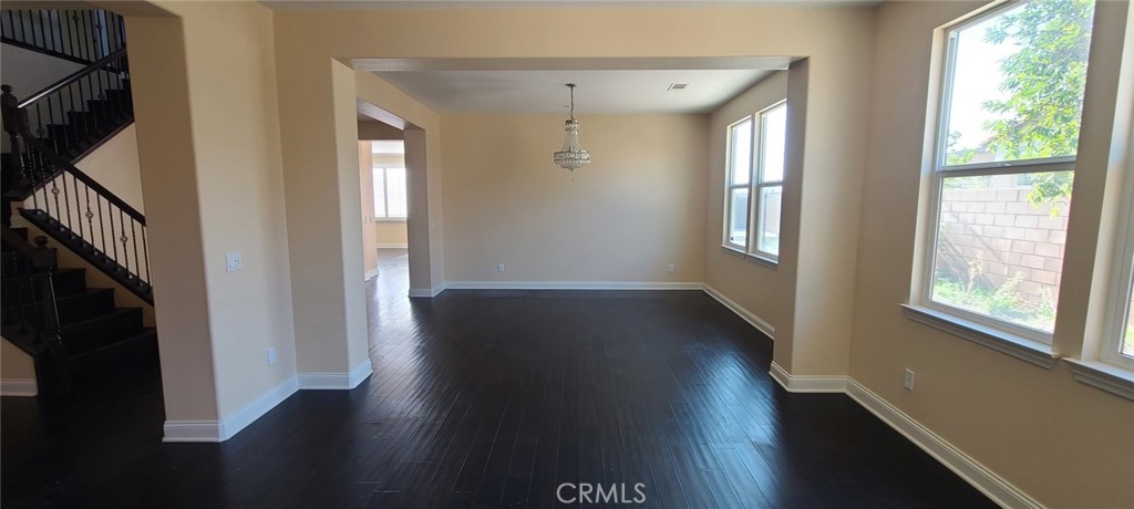 13209 Lima Drive Rancho Cucamonga, CA 91739 - Photo 4 of 25 a view of hallway with wooden floor and windows