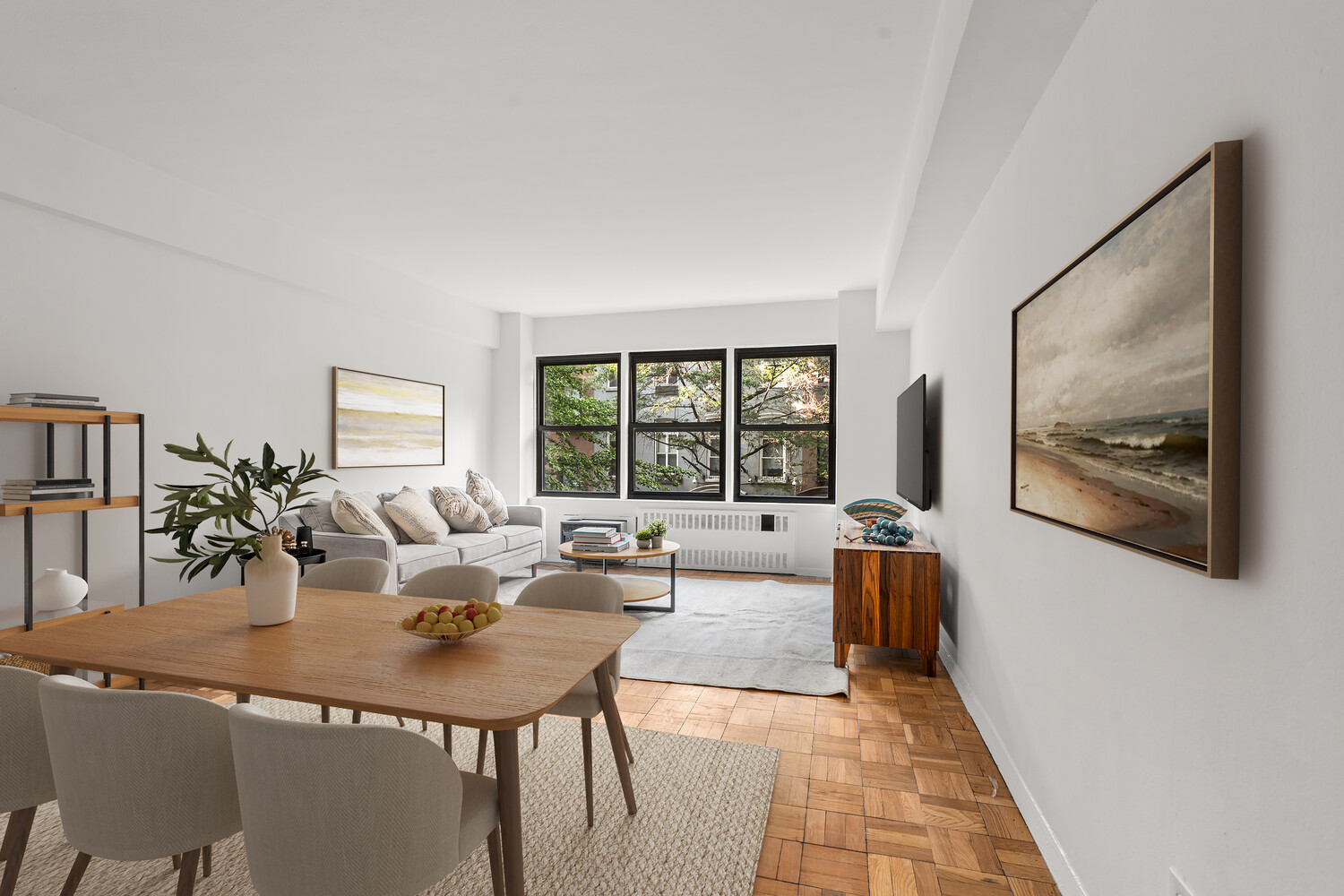 120 East 36th Street, Unit 3F Manhattan, NY 10016 - Photo 1 of 7 a living room with furniture and a large window