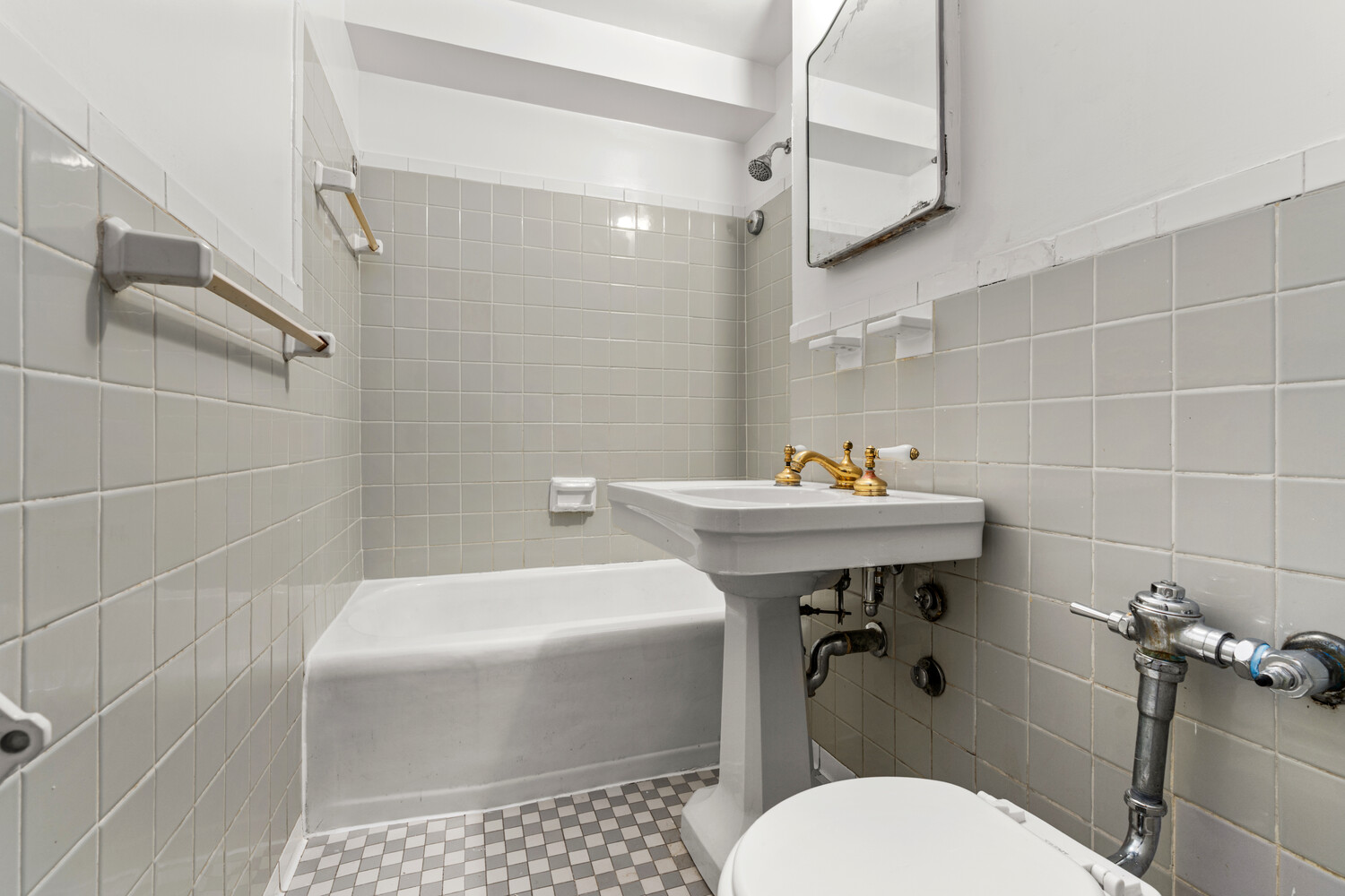 120 East 36th Street, Unit 3F Manhattan, NY 10016 - Photo 4 of 7 a bathroom with a sink toilet and shower