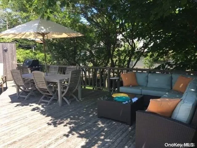 a view of a backyard with sitting area