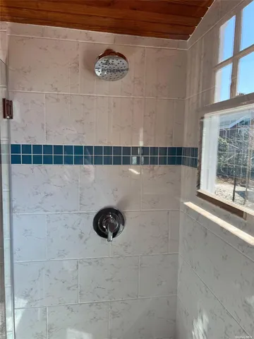 a view of a bathroom with a shower
