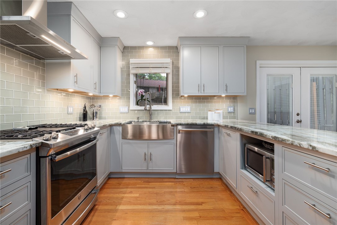 60 Club House Road Coventry, RI 02816 - Photo 34 of 50 Stainless appliances and gas cooking with hood that vents to the exterior