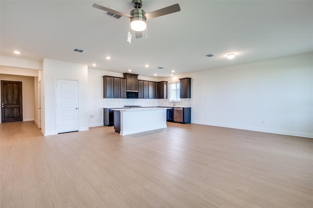 344 Fallbrook Drive Aledo, TX 76008 - Photo 5 of 28 a view of a kitchen with a sink and white cabinets