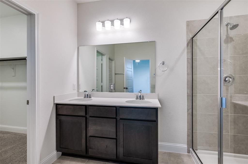 344 Fallbrook Drive Aledo, TX 76008 - Photo 9 of 28 a bathroom with a sink and a mirror