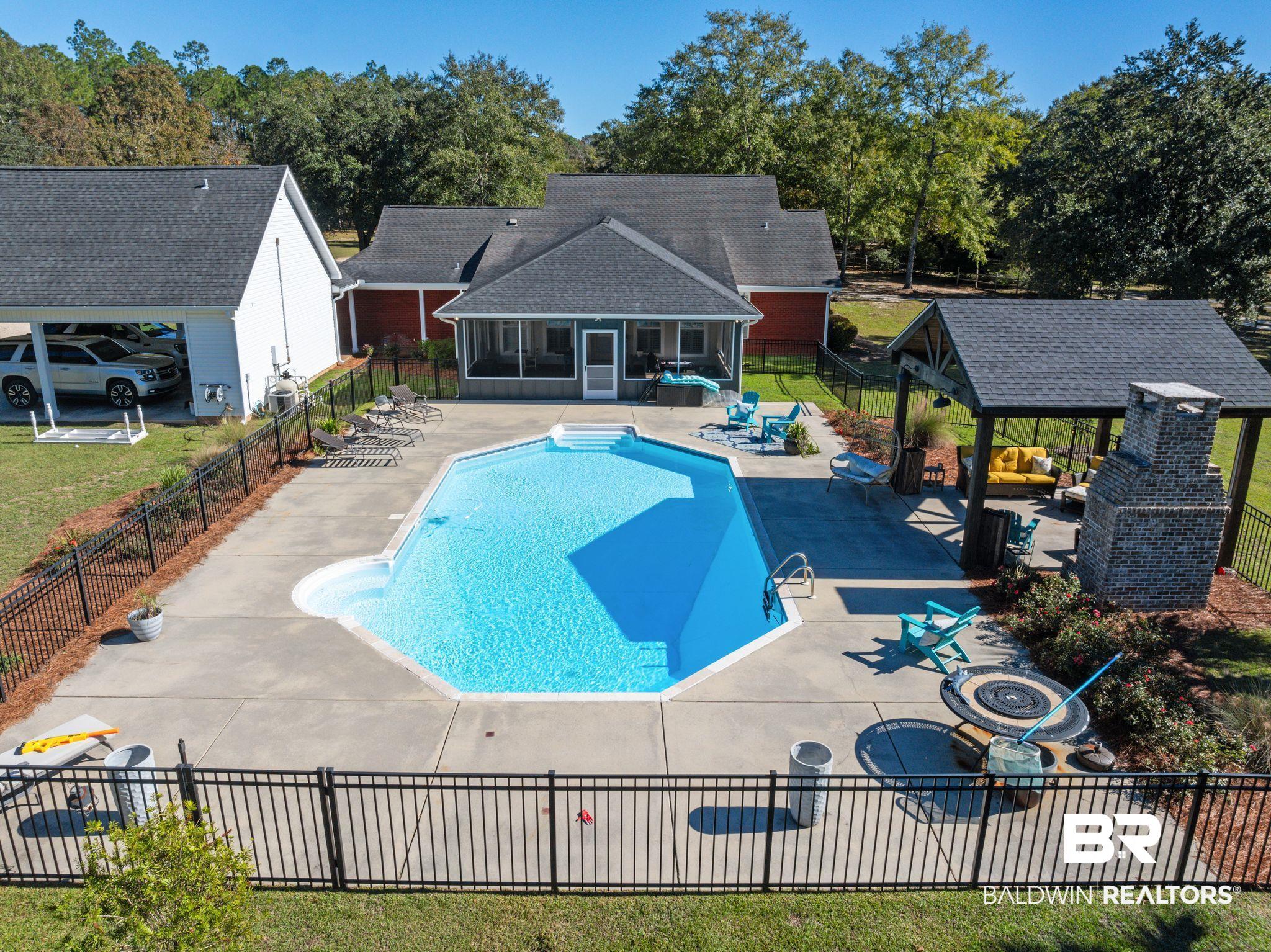 38211-d) V R Byrd Road Bay Minette, AL 36507 - Photo 57 of 58 View of swimming pool featuring a sunroom, a patio area, and a gazebo