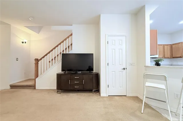 a living room with furniture and flat screen tv