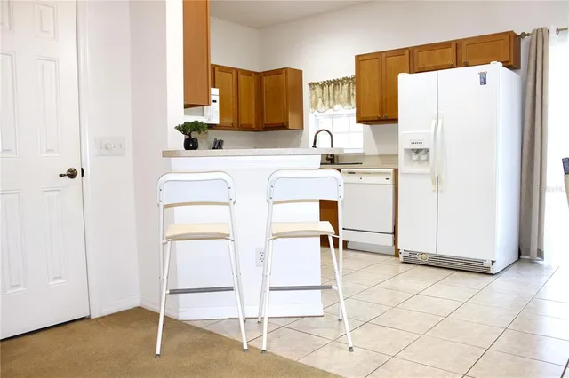 a kitchen with a stove a sink and a microwave