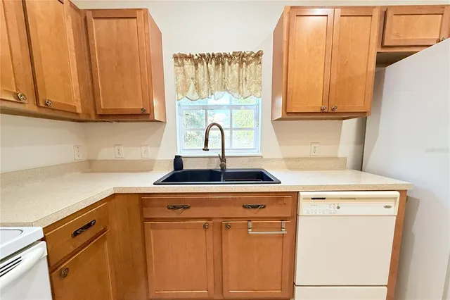 a bathroom with a sink a mirror and a shower