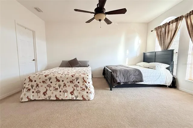 a bedroom with a bed and window