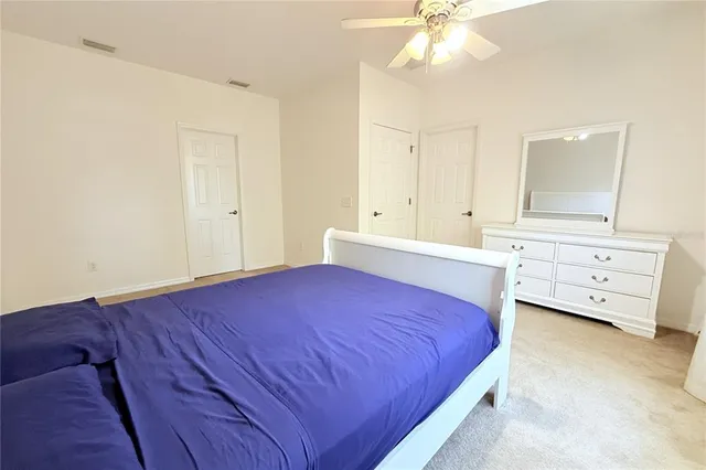 an aerial view of house with yard and swimming pool