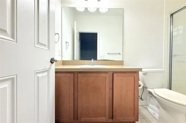 an aerial view of house with yard and swimming pool