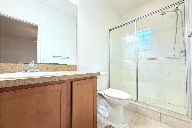 an aerial view of a house with a garden and lake view