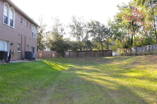 a view of outdoor space with garden and trees