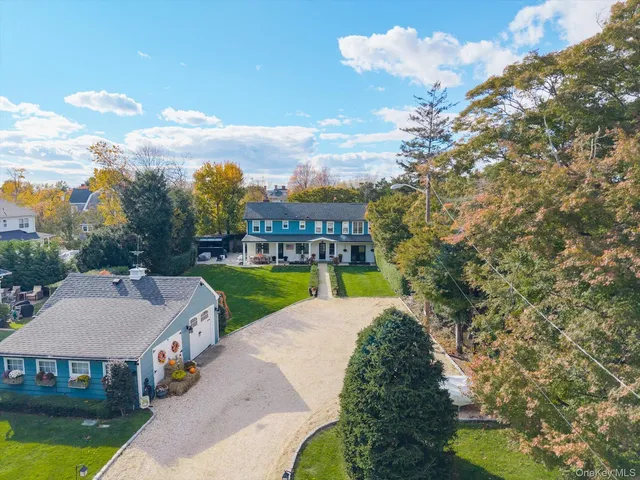 a aerial view of a house with swimming pool and big yard