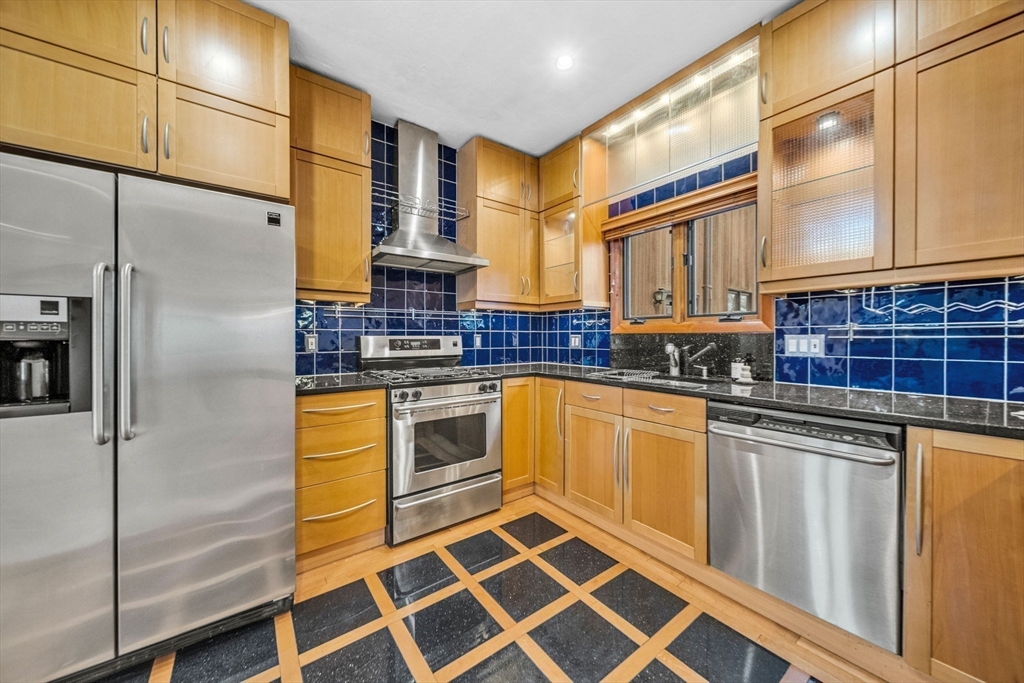 16 Carthay Circle, Unit 16 Newton, MA 02461 - Photo 12 of 29 a kitchen with stainless steel appliances and counter space