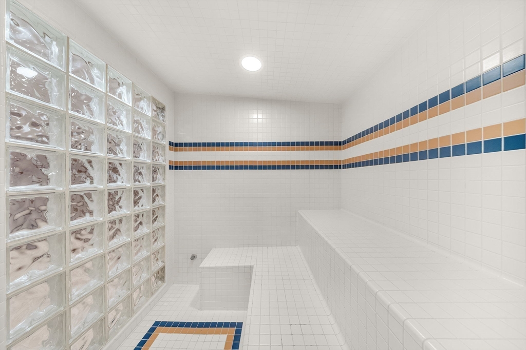 16 Carthay Circle, Unit 16 Newton, MA 02461 - Photo 25 of 29 a bathroom with a shower and a shower