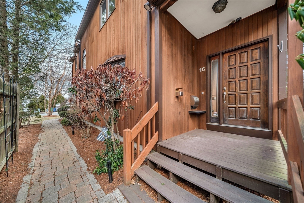 16 Carthay Circle, Unit 16 Newton, MA 02461 - Photo 3 of 29 a view of a backyard with sitting area