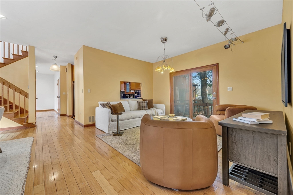 16 Carthay Circle, Unit 16 Newton, MA 02461 - Photo 8 of 29 a living room with furniture and a wooden floor