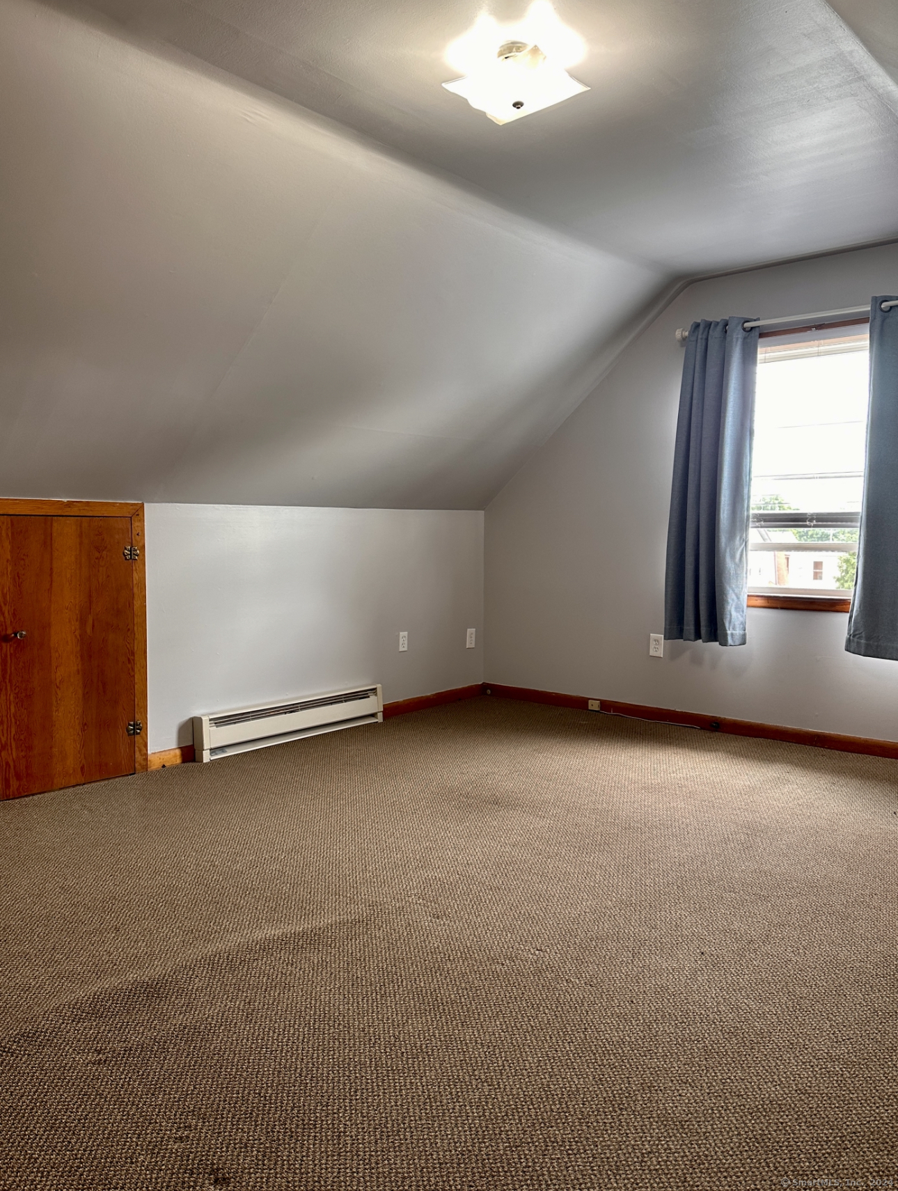122 Hansen Avenue, Unit 3 Bridgeport, CT 06605 - Photo 13 of 14 an empty room with a empty space and windows