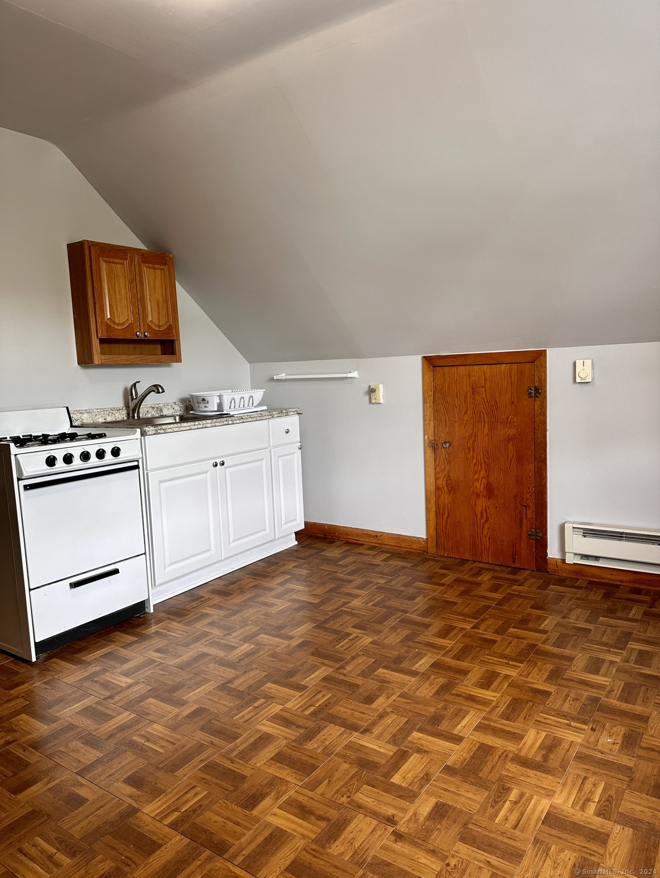 122 Hansen Avenue, Unit 3 Bridgeport, CT 06605 - Photo 3 of 14 a view of a livingroom with furniture and mirror