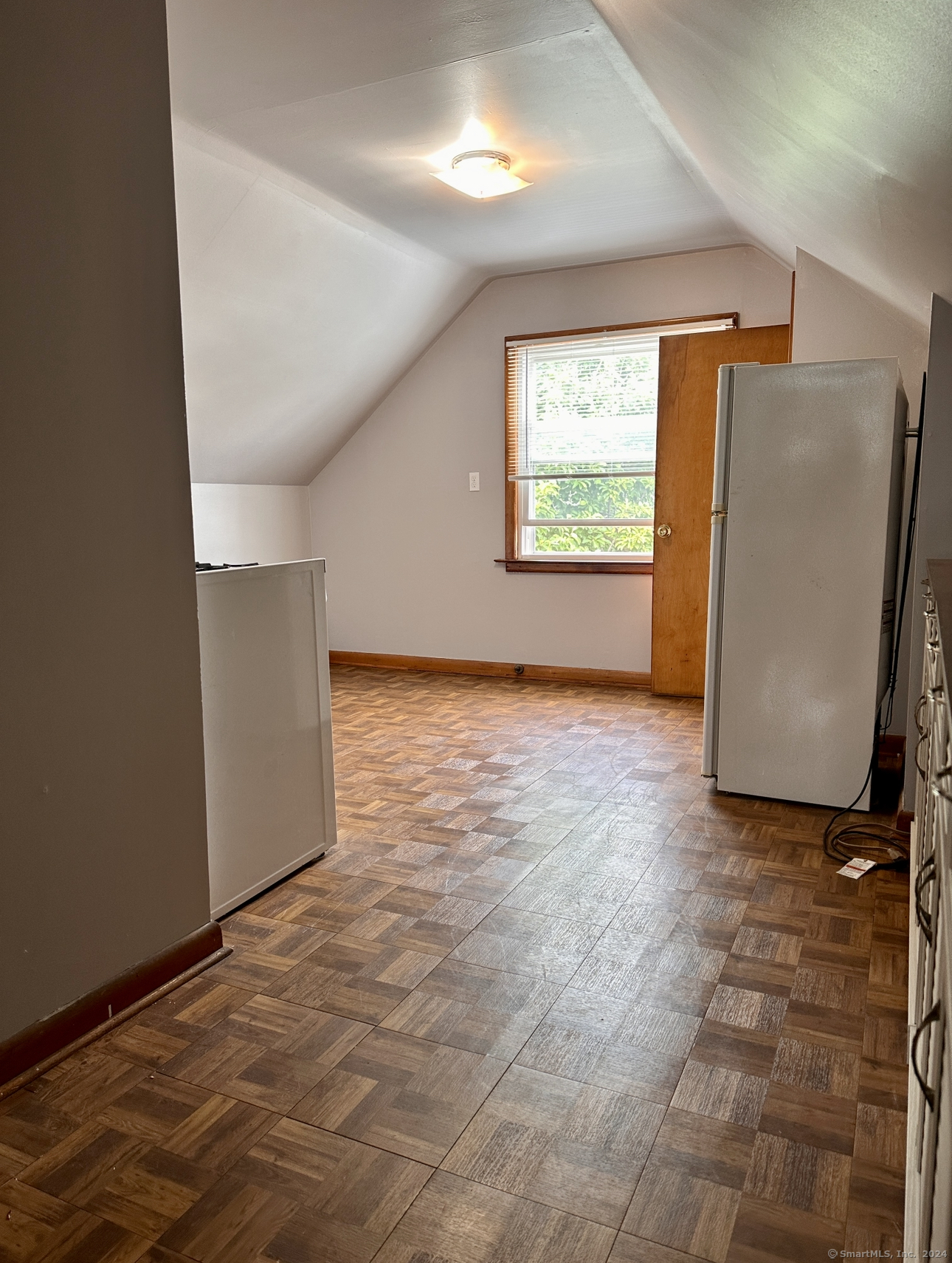 122 Hansen Avenue, Unit 3 Bridgeport, CT 06605 - Photo 6 of 14 an empty room with windows