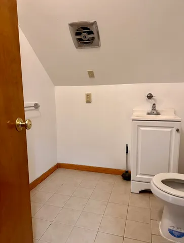a view of a storage & utility room with a window
