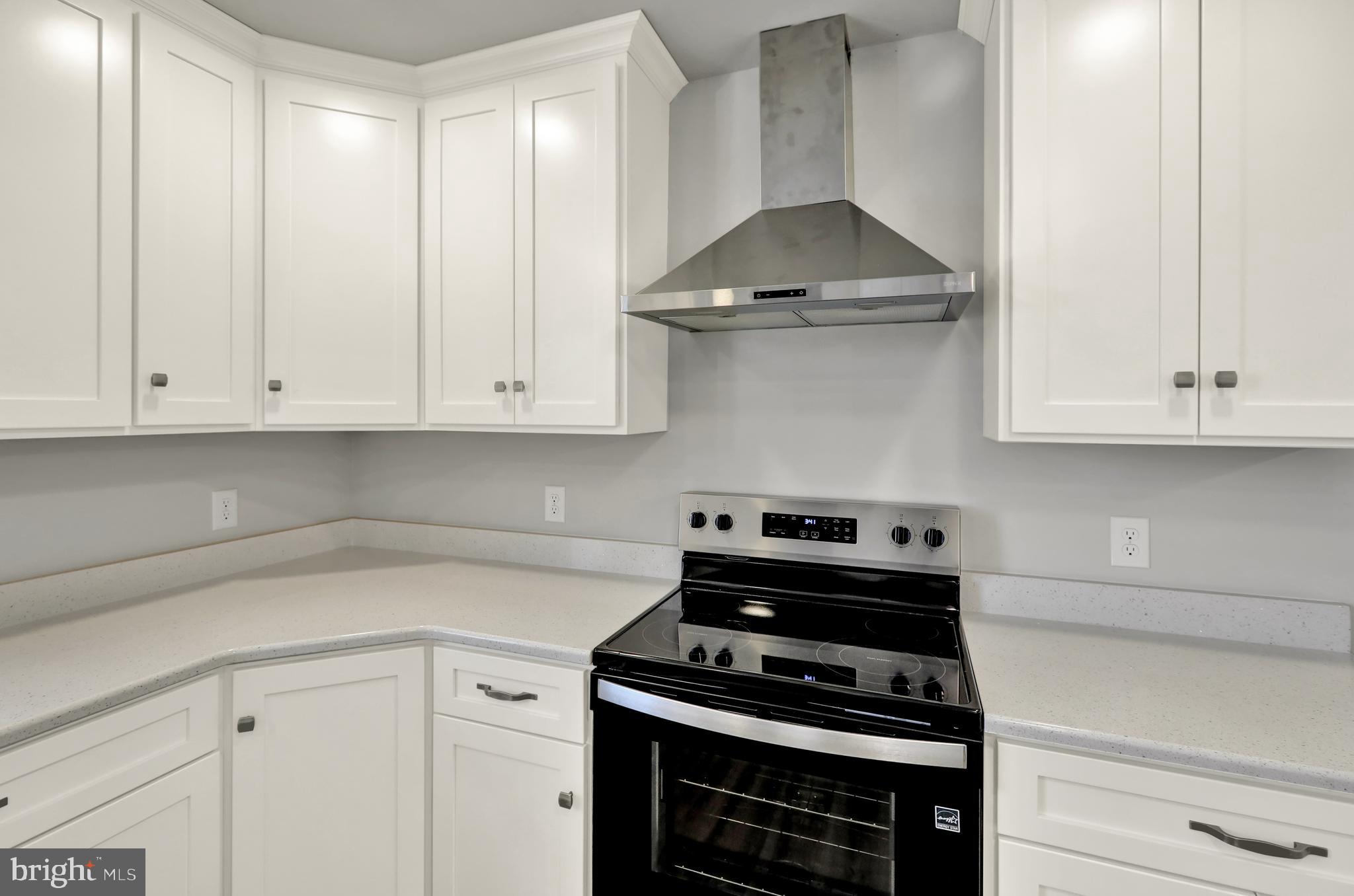20 Rolling Meadow Road Lebanon, PA 17046 - Photo 11 of 31 a kitchen with stainless steel appliances a stove and white cabinets