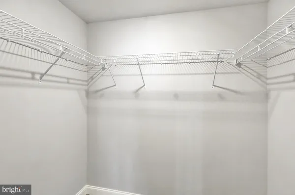 a view of a room with racks on the wall