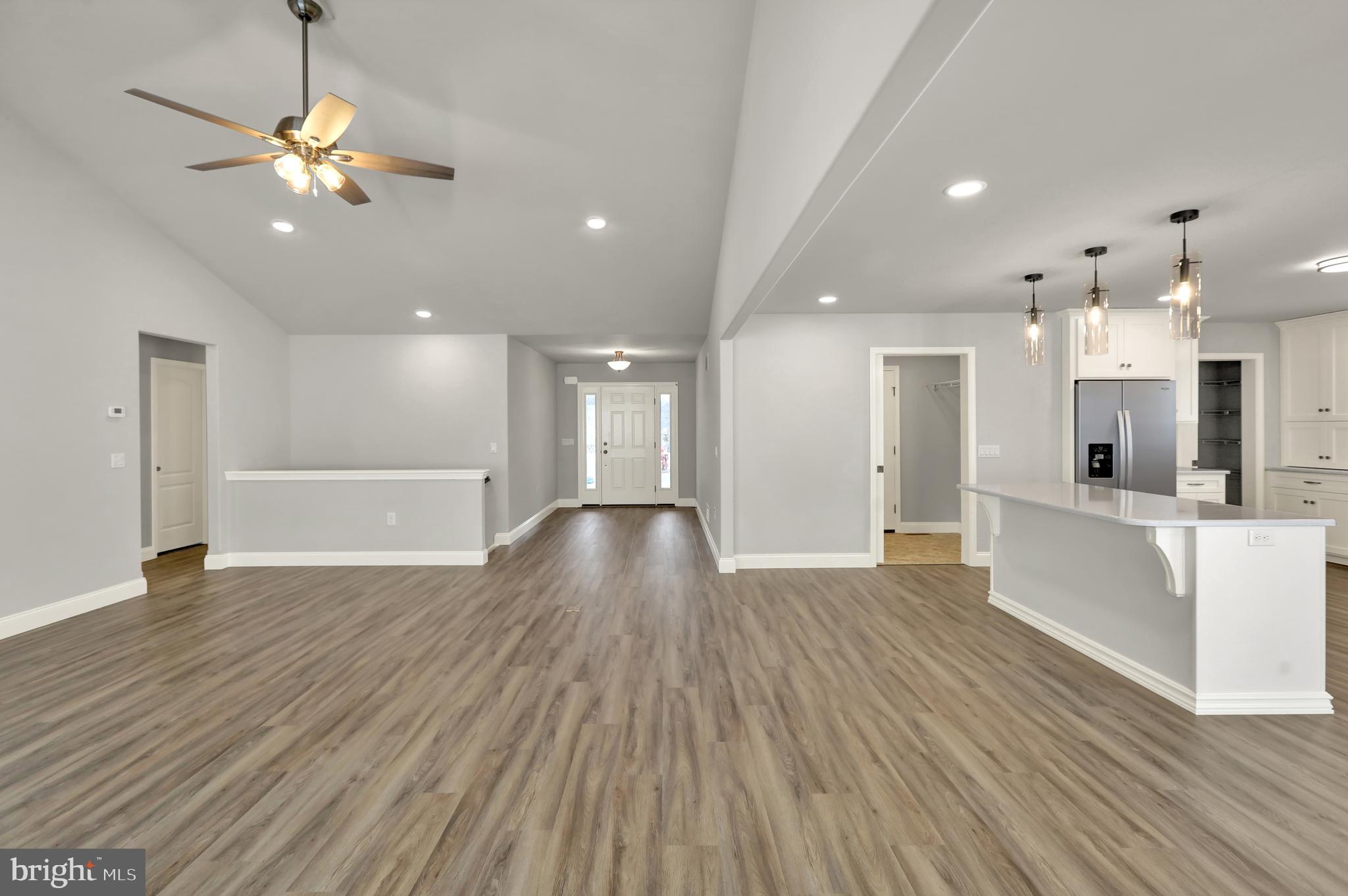 20 Rolling Meadow Road Lebanon, PA 17046 - Photo 6 of 31 a view of an empty room and kitchen with wooden floor