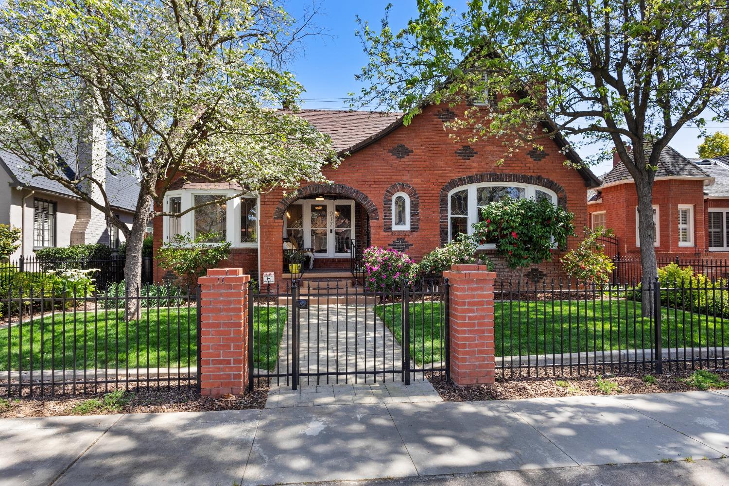 a front view of a house with a garden