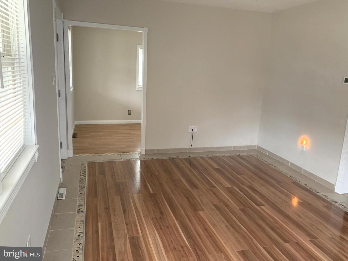 38 Hazelhurst Avenue Ewing, NJ 08638 - Photo 4 of 10 a view of a room with wooden floor and staircase