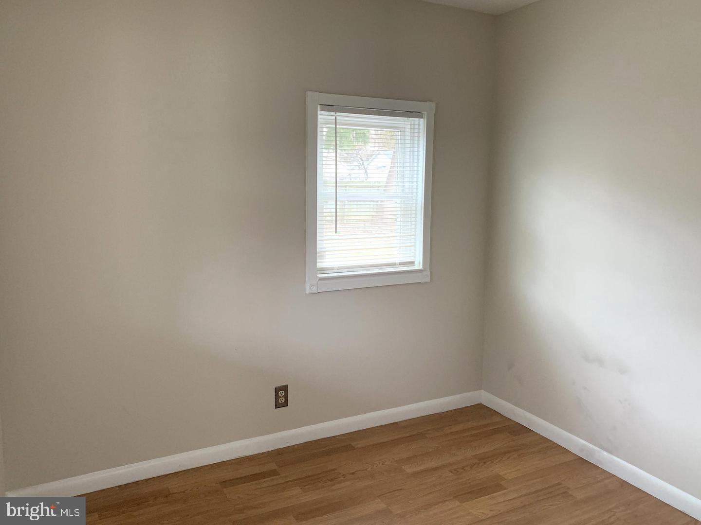 38 Hazelhurst Avenue Ewing, NJ 08638 - Photo 6 of 10 an empty room with wooden floor and window