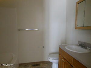 366 Quail Way Fallon, NV 89406 - Photo 15 of 18 a bathroom with a sink and toilet