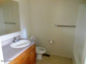 366 Quail Way Fallon, NV 89406 - Photo 16 of 18 a bathroom with a sink and a toilet