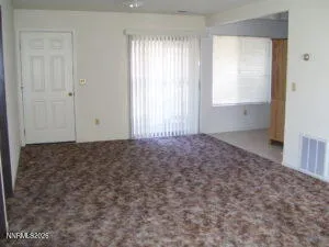 a kitchen with granite countertop a stove and a refrigerator