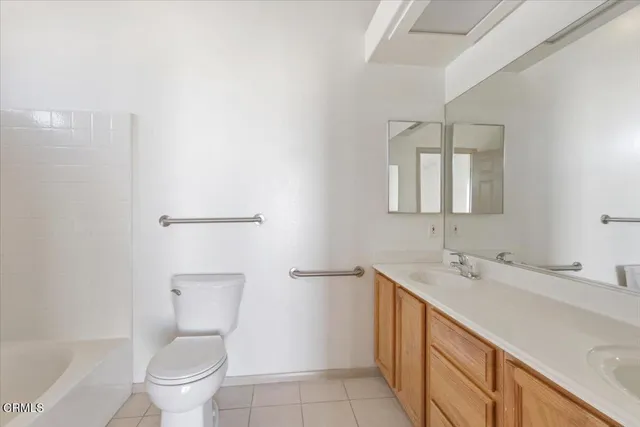 an empty room with a window and a ceiling fan