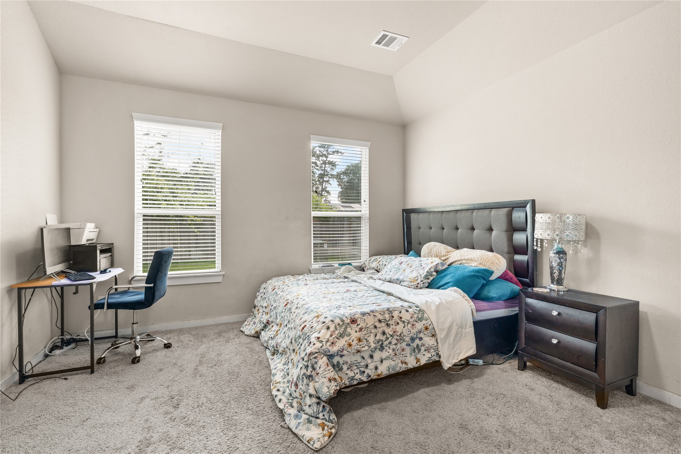 22939 Aspen Vista Dr Spring Spring, TX 77373 - Photo 10 of 29 End each day in a spacious primary suite that offers plenty of room for a king sized bed, additional seating