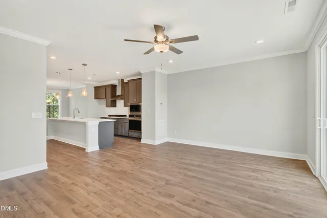 a view of kitchen with wooden floor and window