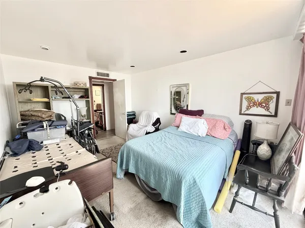 a bed room with a bed furniture and a desk