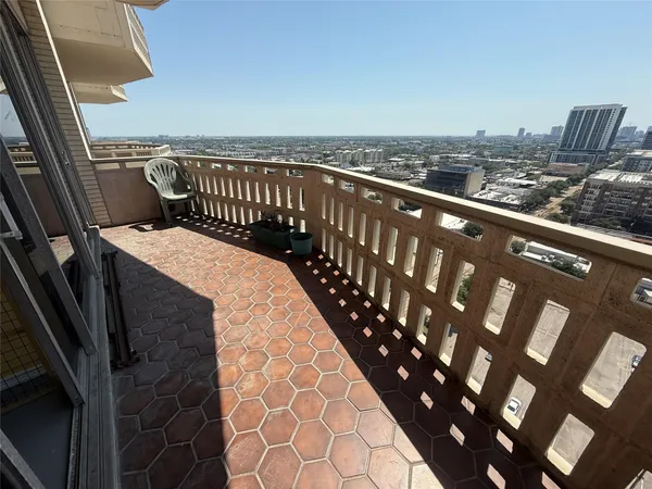 a balcony with an outdoor space
