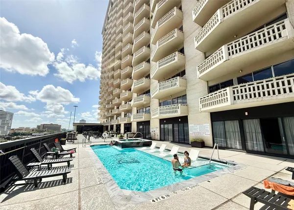 a view of a building with backyard